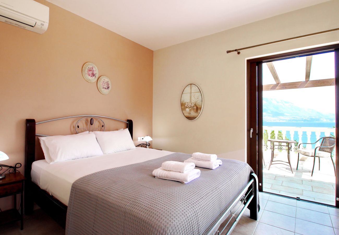 Upper double bedroom with ensuite and large balcony with sea views