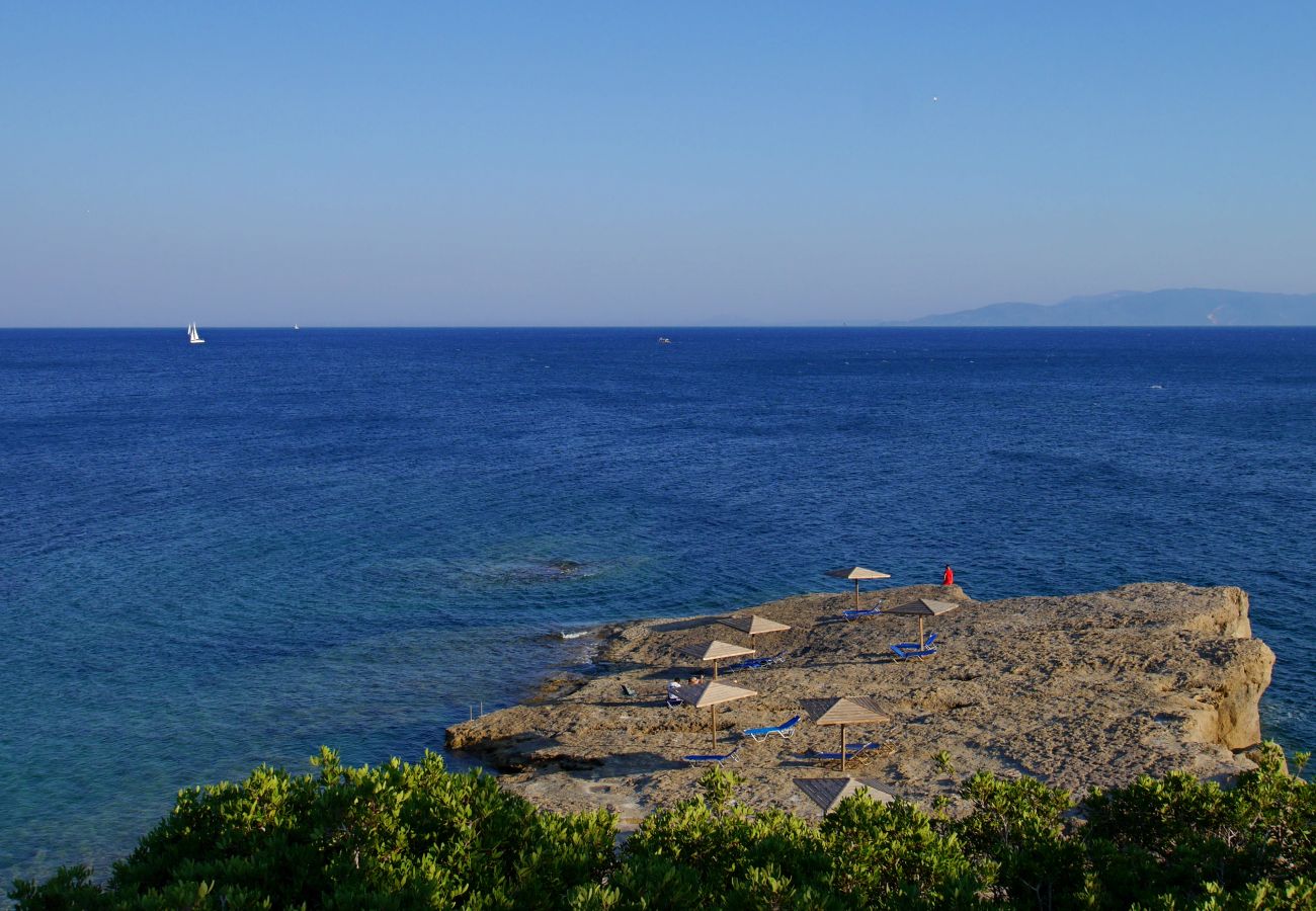 Cape Liakas rock with sunbeds is about 100m walk away to dip in the sea