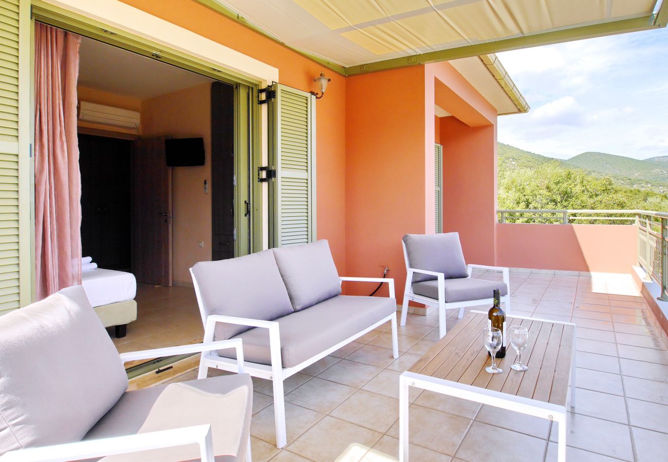 Comfy outdoor lounging on balcony at Villa Nireaus