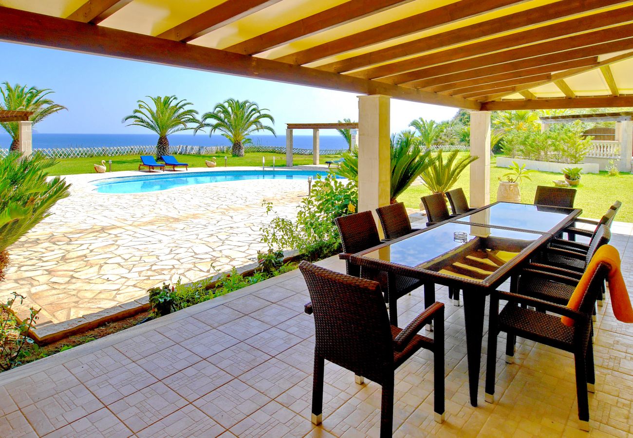 Dining on the covered terrace at Villa Alexandros
